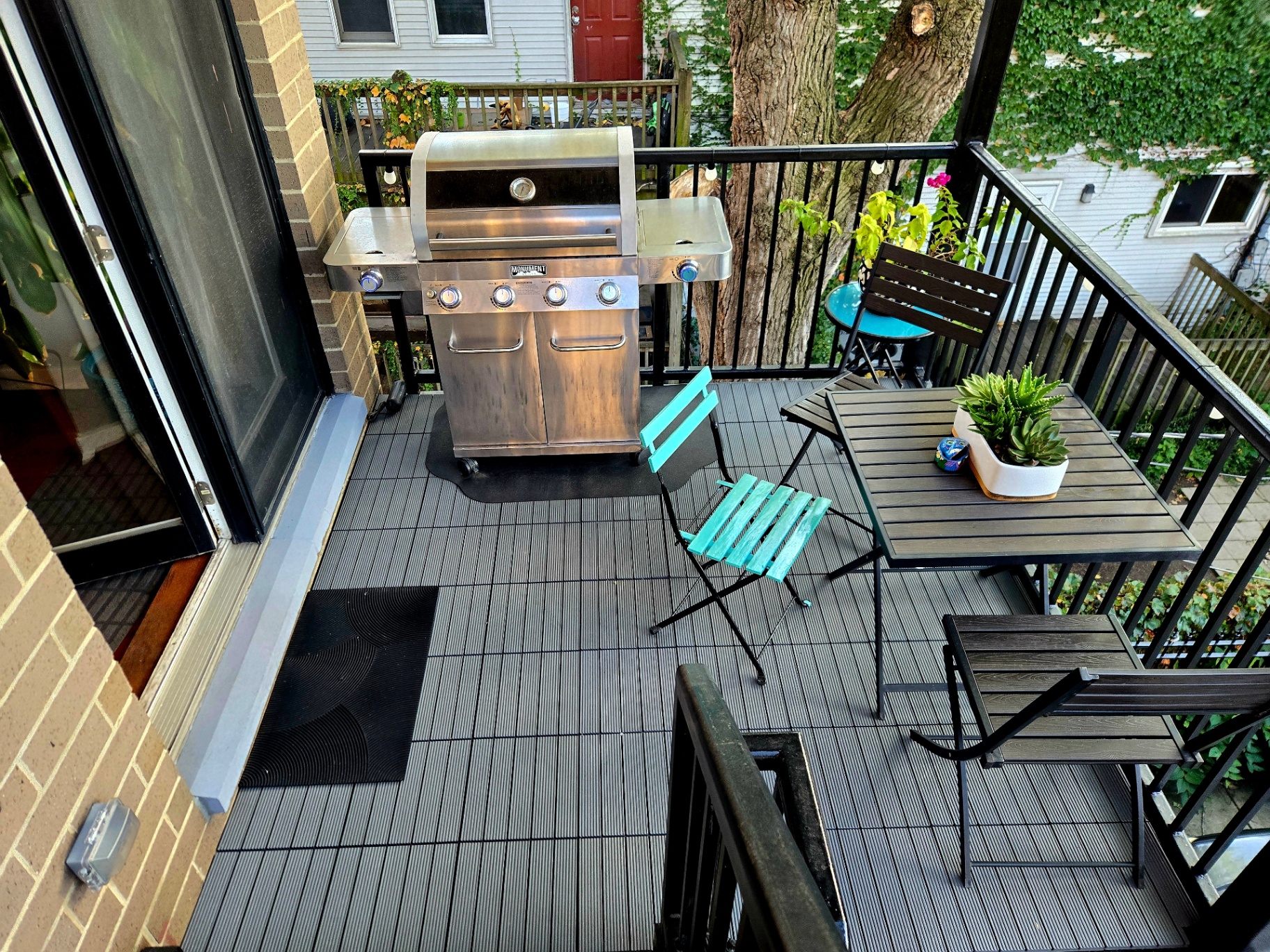 Patio with stainless grill and bistro set