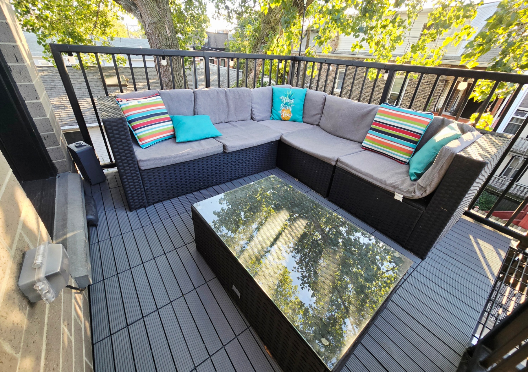 Patio sectional under leafy tree canopy